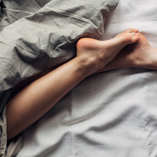 Woman's Legs in Bed - Understanding Sleep Stages