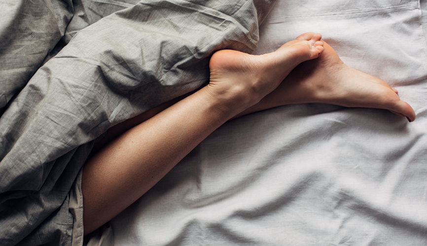 Woman's Legs in Bed - Understanding Sleep Stages