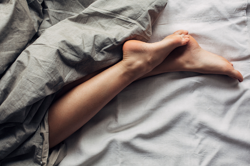 Woman's Legs in Bed - Understanding Sleep Stages