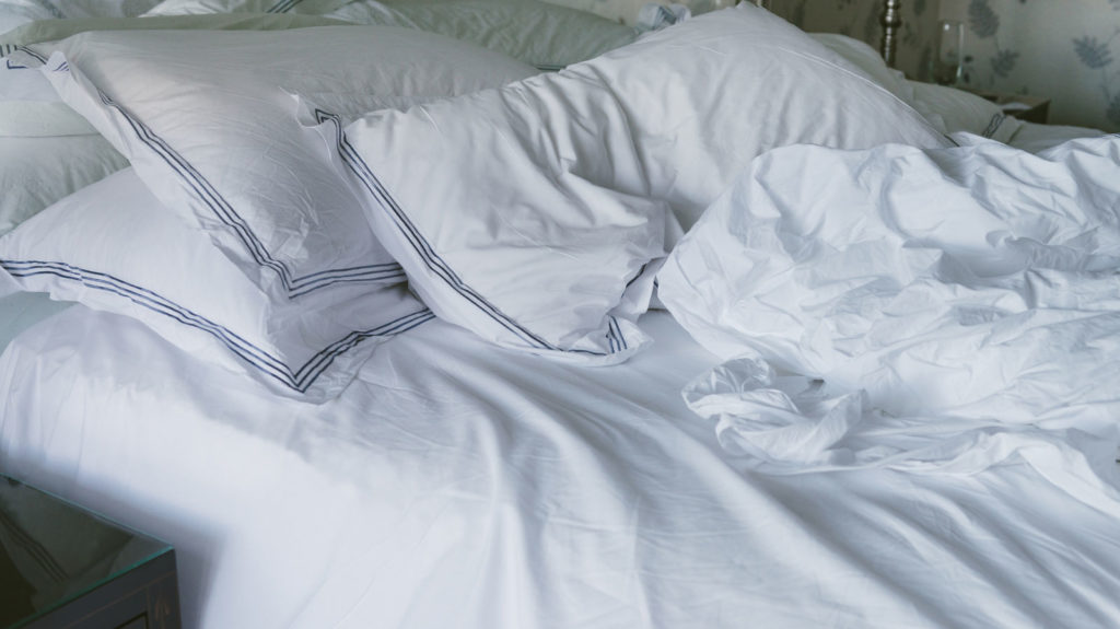 Image of an unmade bed