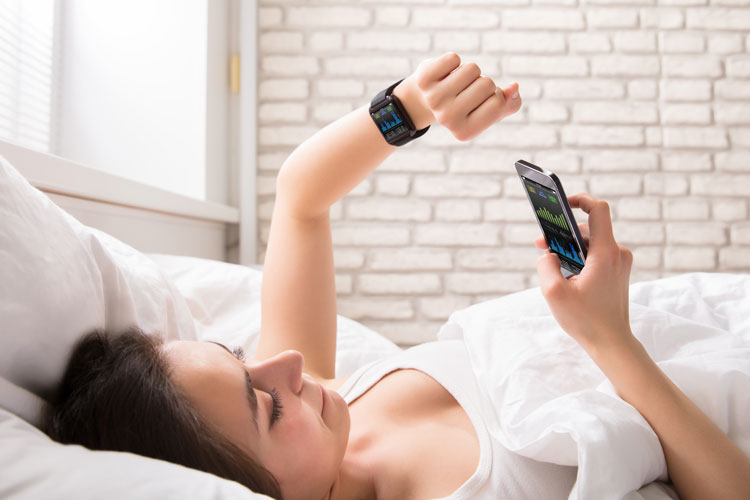 women-using-sleep-app-to-track-data
