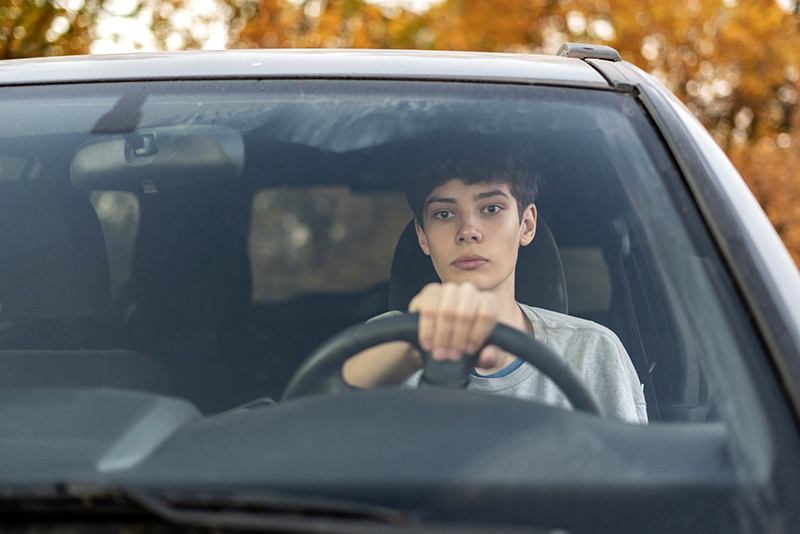 tired teenager driving